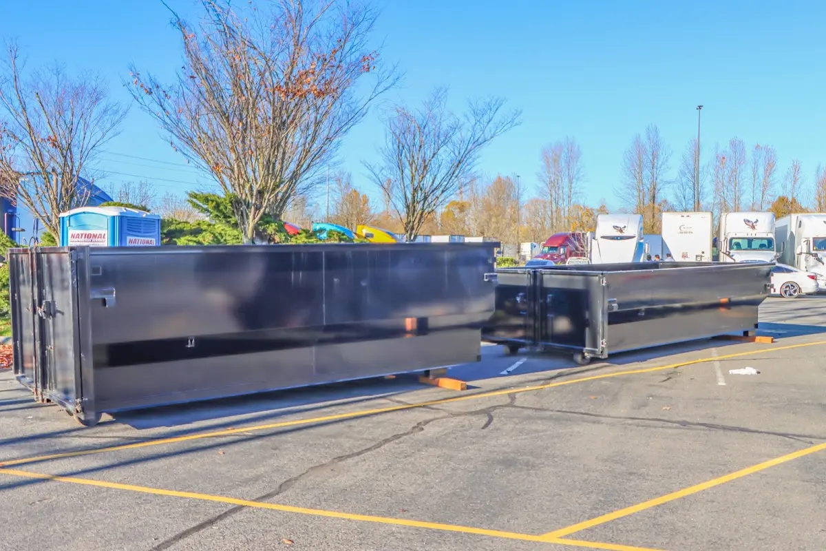 Professional dumpster rental service with roll-off container on residential driveway in Fort Lauderdale